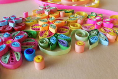 What are some techniques for paper quilling?